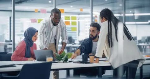 A group of workers around a table