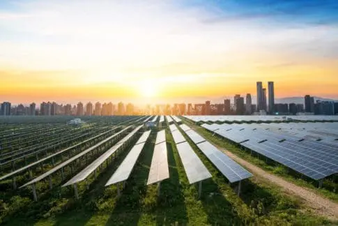 Solar panels in front of a city - Climate