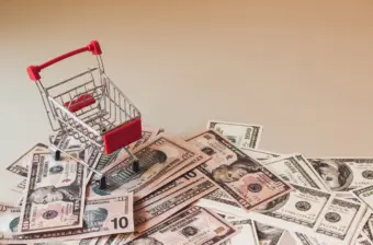 Grocery cart on cash represents federal outlays to SNAP