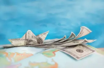 US dollar bills on rest on globe