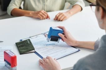 An employee approves an application form