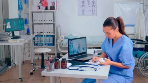 A nurse sees a patient over telehealth