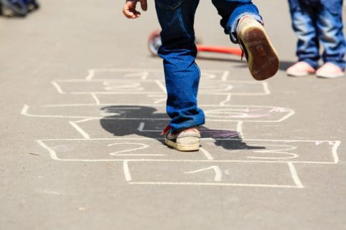 A child plays hopscotch