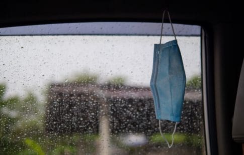 Mask and rain. Poverty during the pandemic