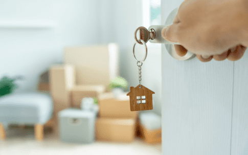 Door opens to a new rental with a house keychain